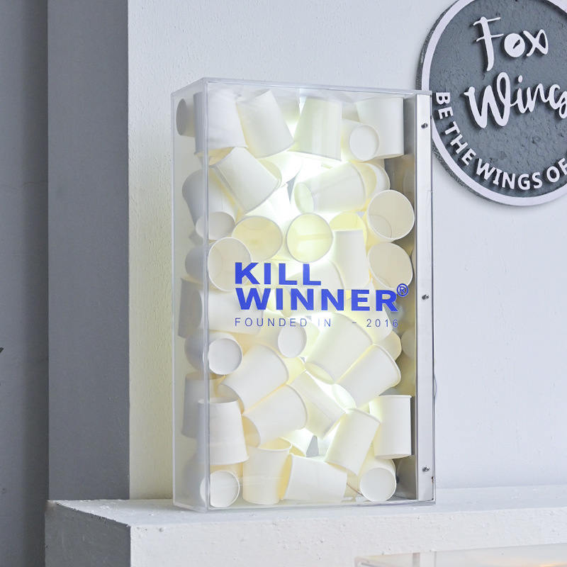 acrylic light box filled with white paper cups