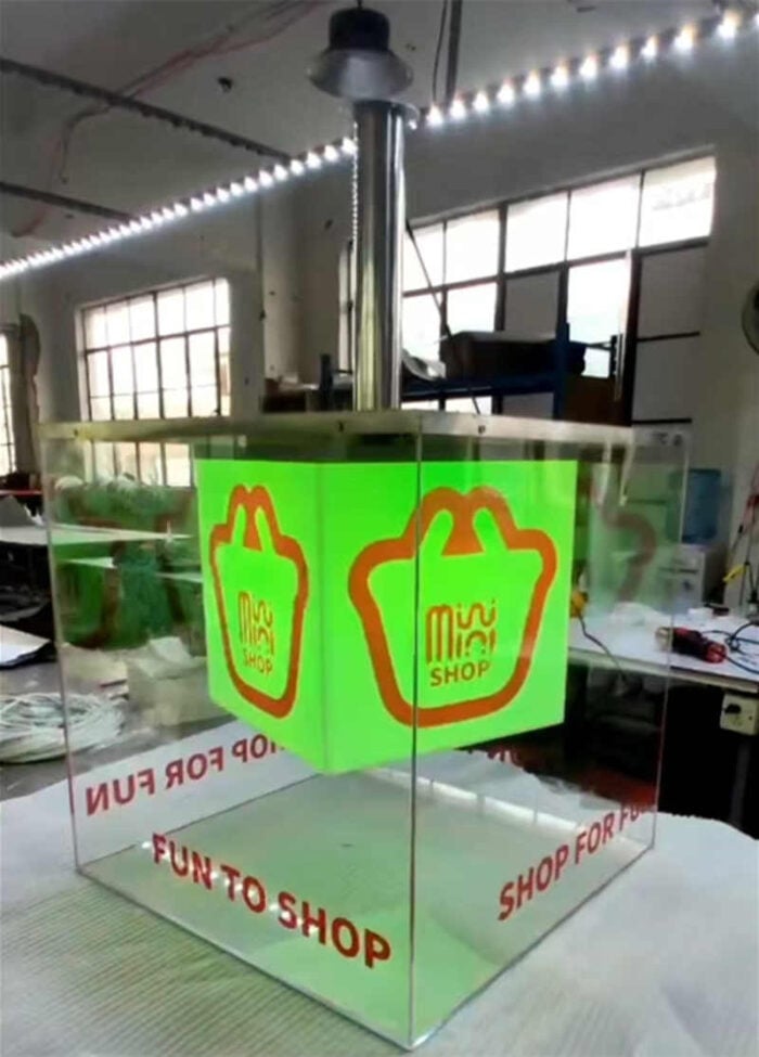 ceiling hanging clear cube rotating acrylic lightbox with green LED