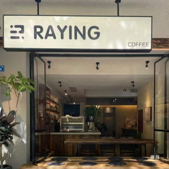shop under awning lightbox sign with white light