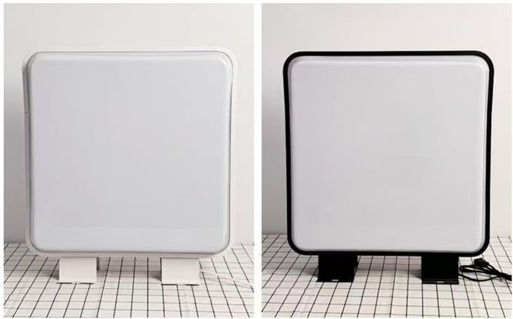 white and black frame square vacuum light box