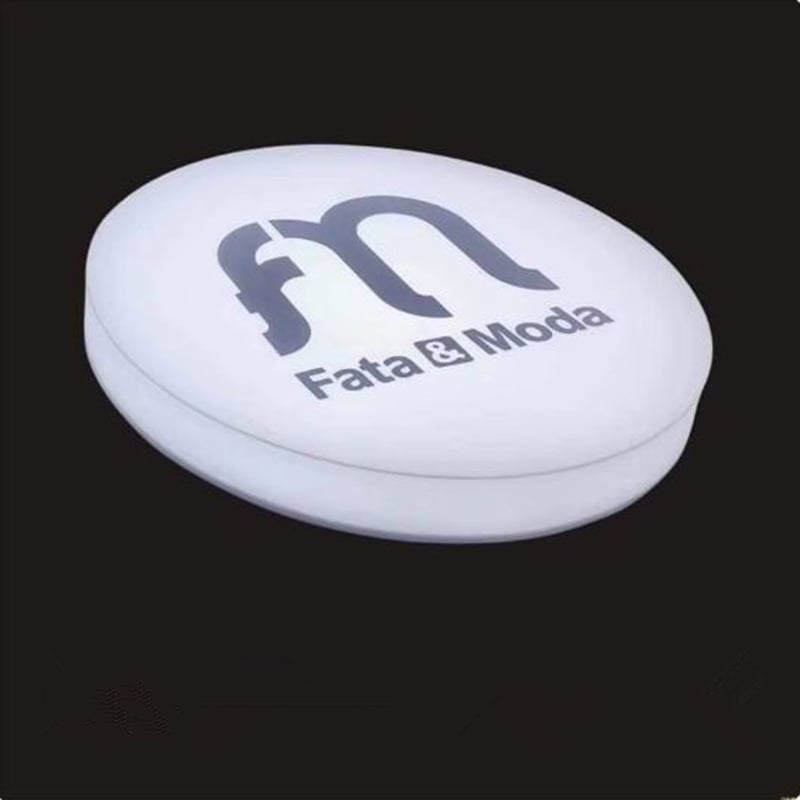 white round acrylic light box sign with black logo
