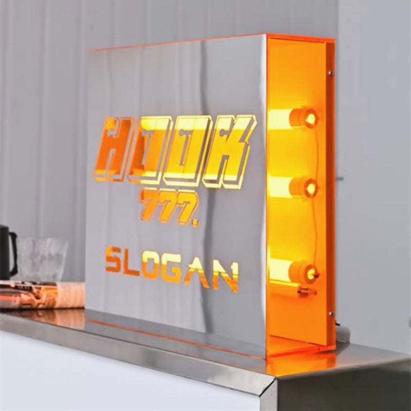 square shaped mirrored lightbox sign with orange light