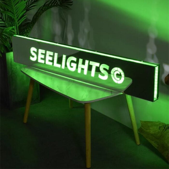 rectangular mirrored lightbox sign with green light