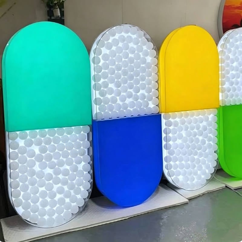 capsule acrylic light box filled with ocean balls